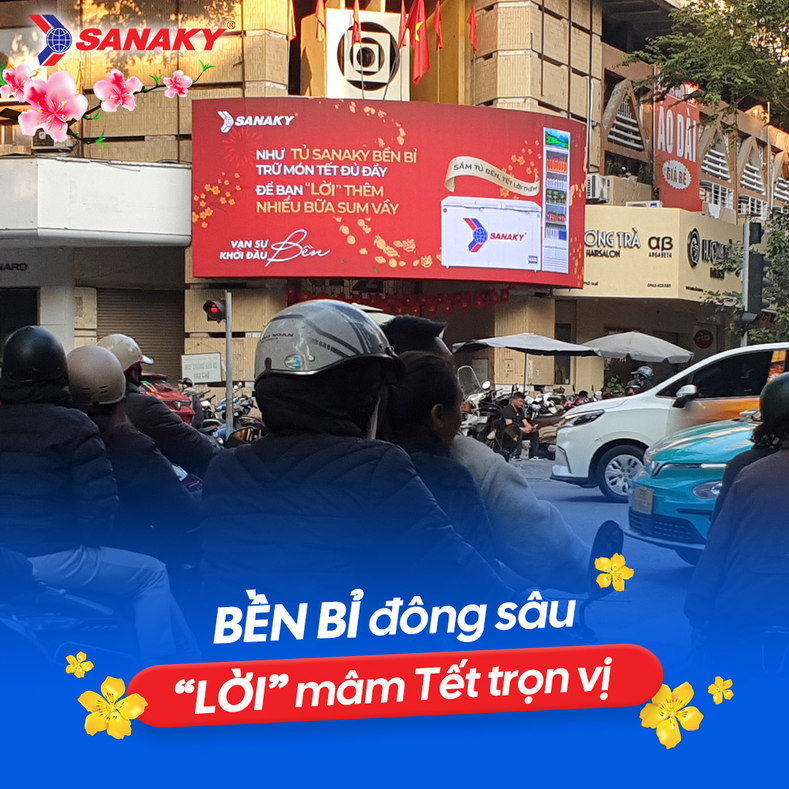 Sanaky street billboard viewed through Tết traffic